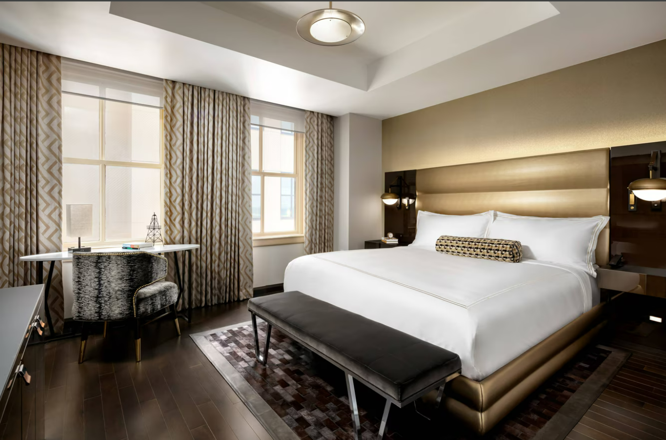 Quarto do Hotel Sinclair com design moderno, exemplo de inovação tecnológica em hotéis voltada à eficiência energética e ao conforto do hóspede.